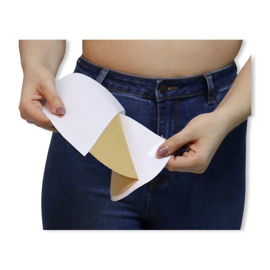 Women in jeans peeling off backing to adhesive Sand EGG CUPS
