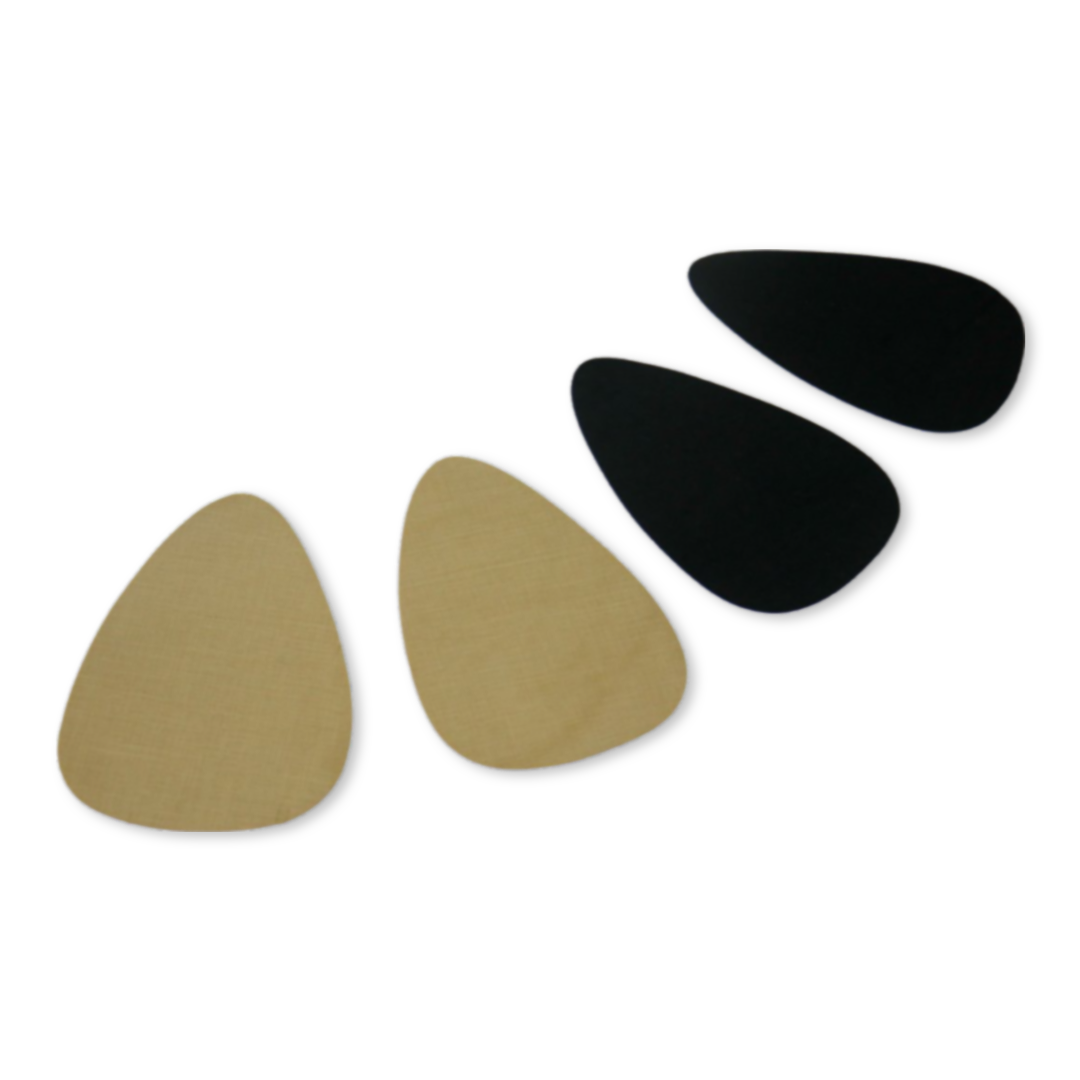 Two pairs of EGG CUPS, one Sand one Onyx, arranged in a curve pattern