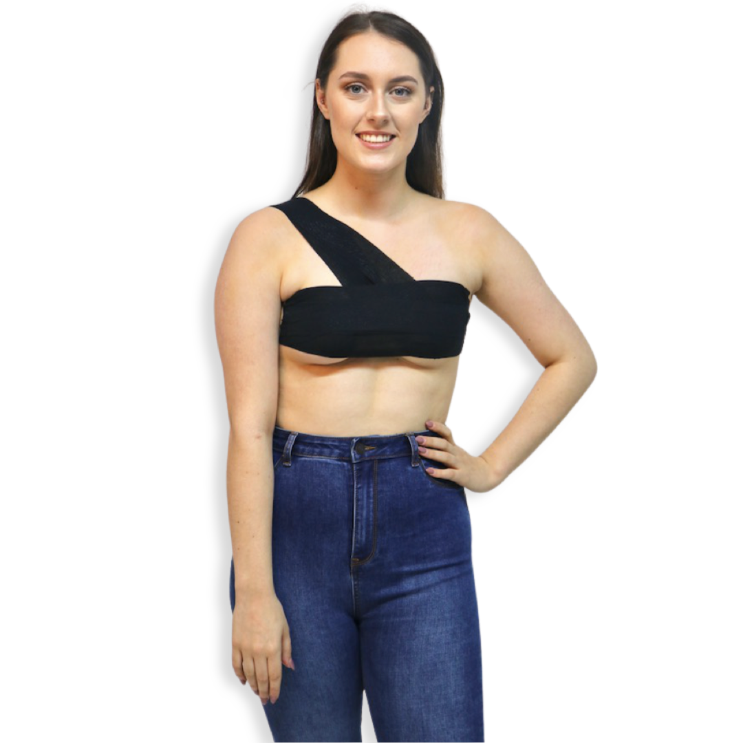 Woman in jeans, wearing Onyx TITTY TAPE around chest and strapped over one shoulder